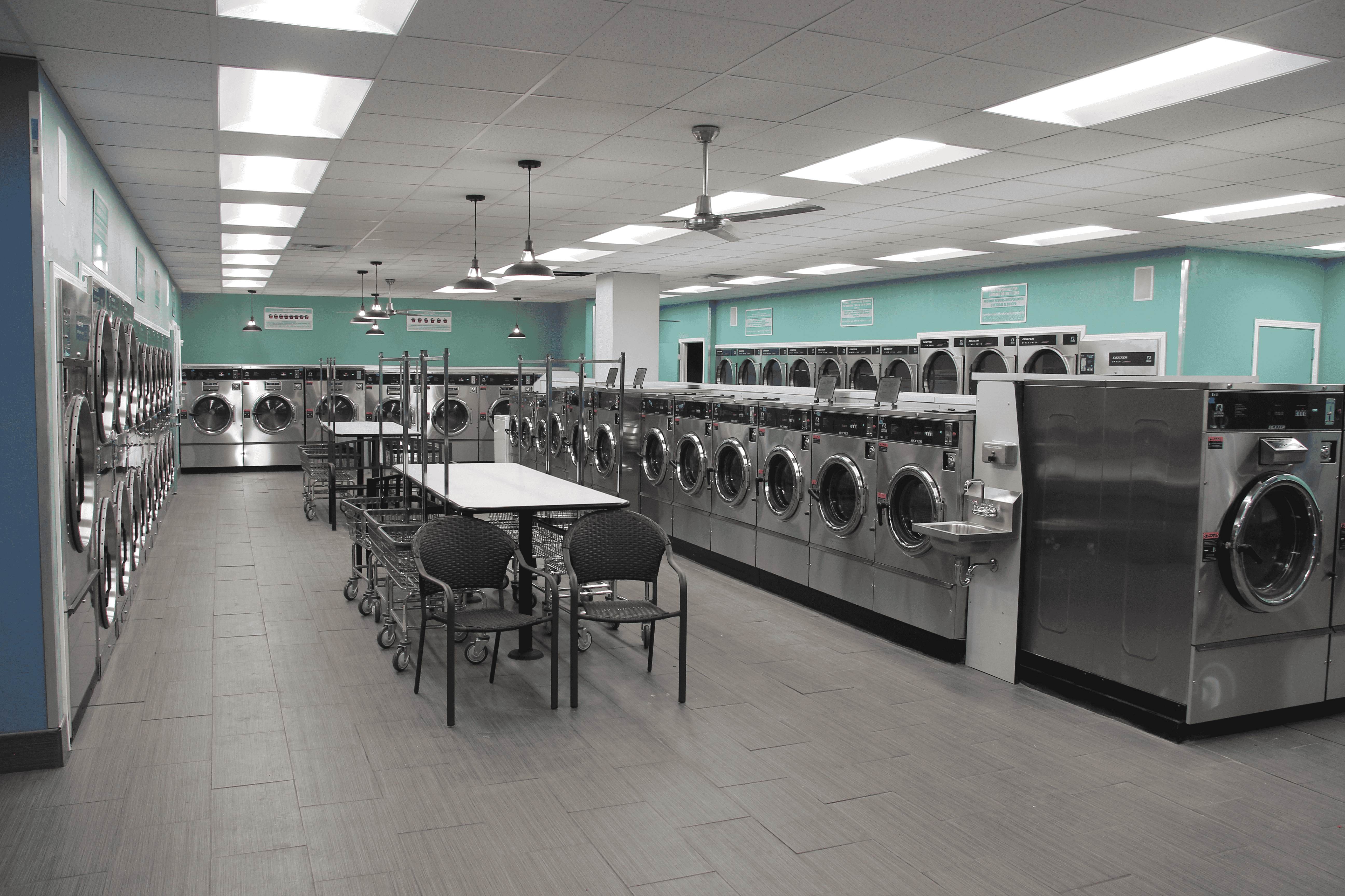 Spacious modern laundromat with multiple washing machines
