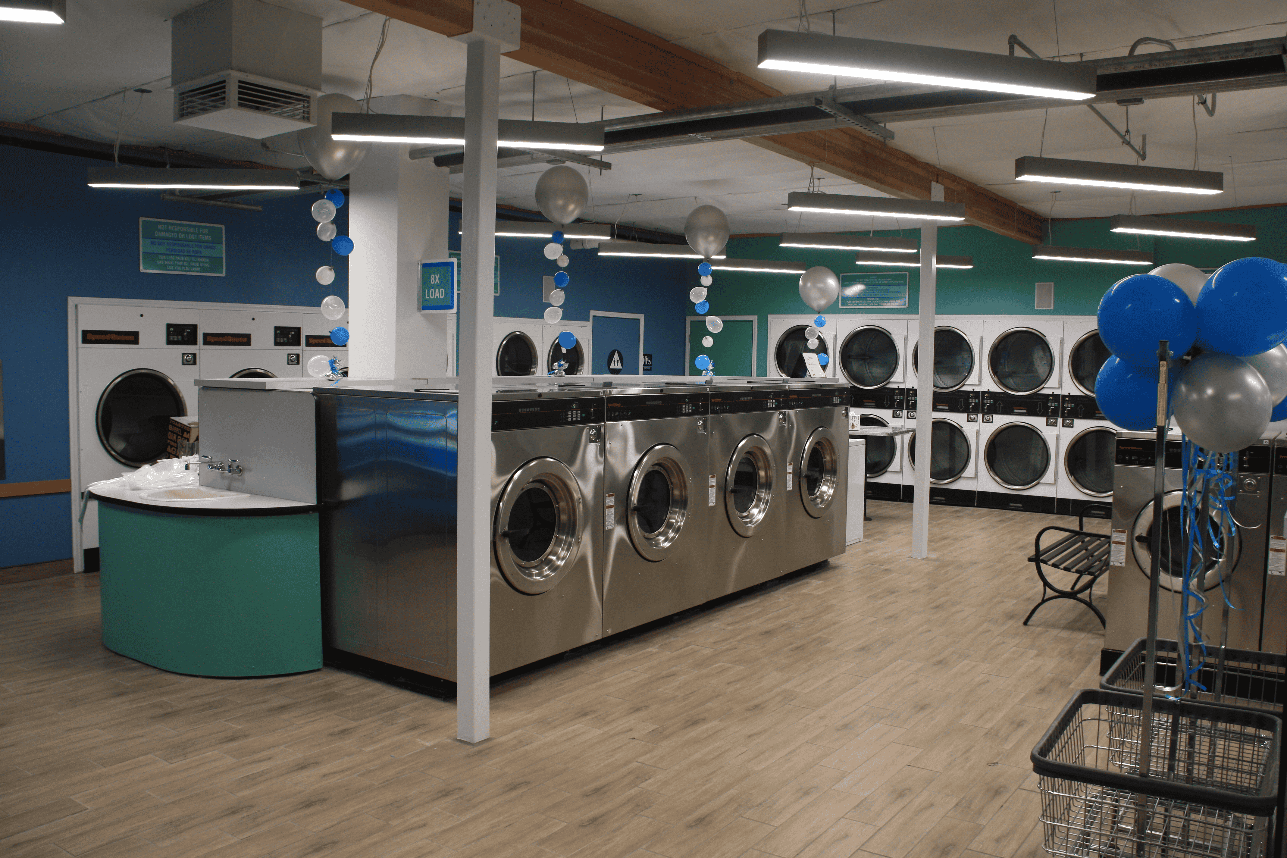 Modern laundromat interior with multiple washing machines