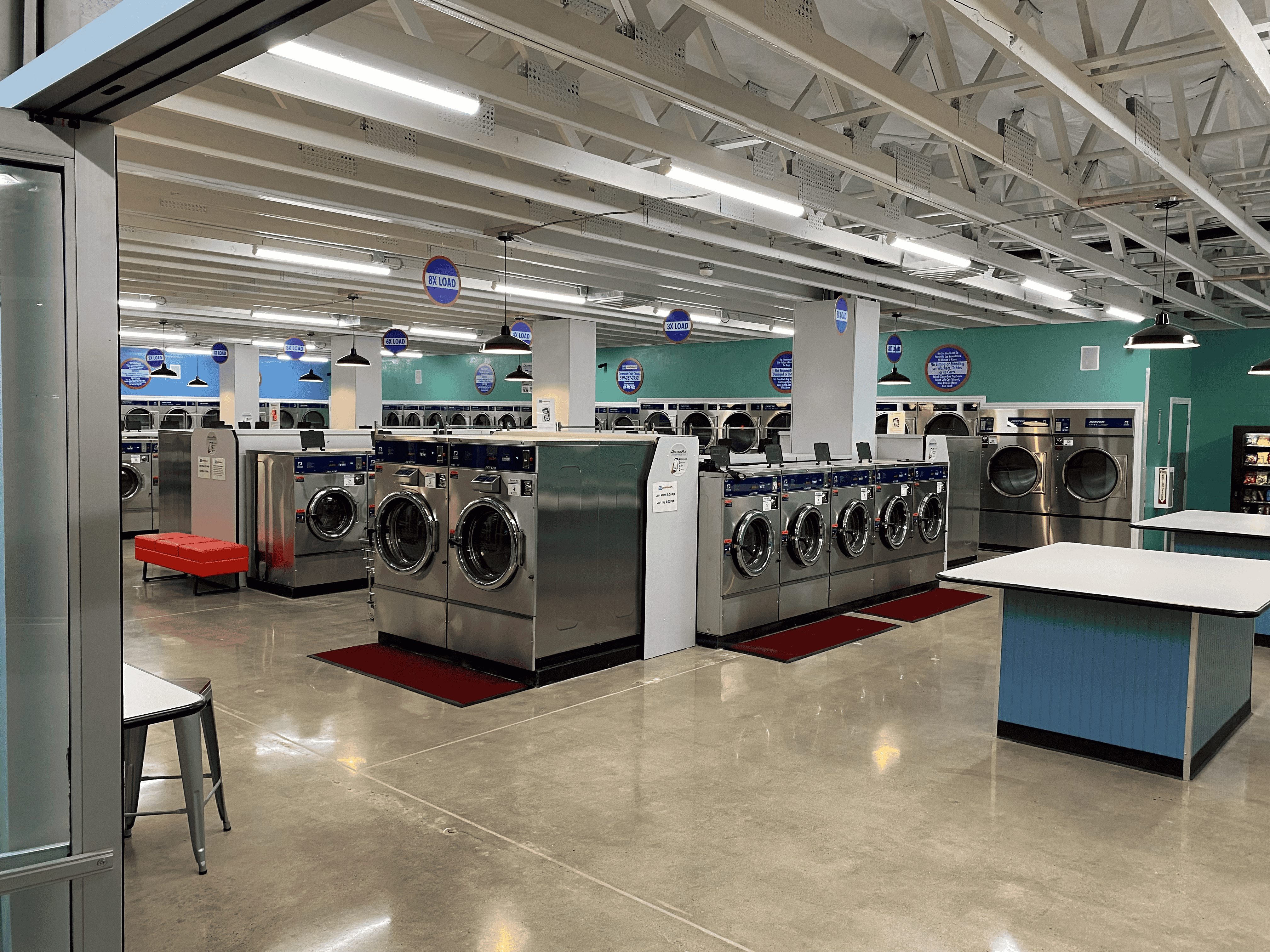 Modern, spacious laundromat with multiple washing machines