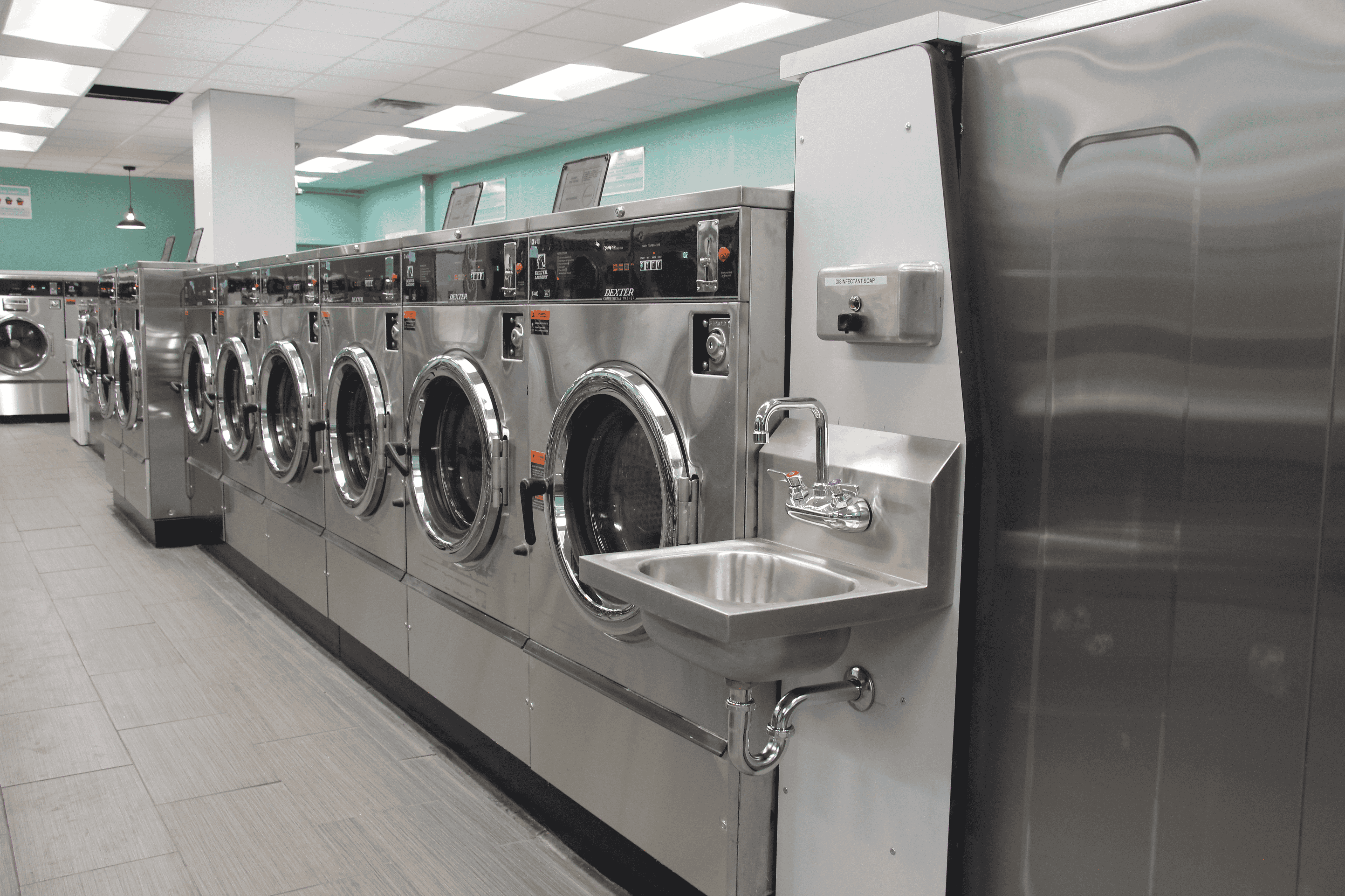 Row of modern washers in a clean laundromat